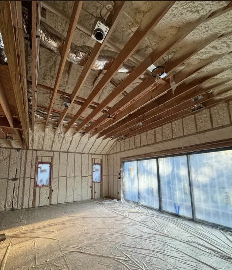 Interior walls and ceiling insulated with spray foam during new construction in Woodlake